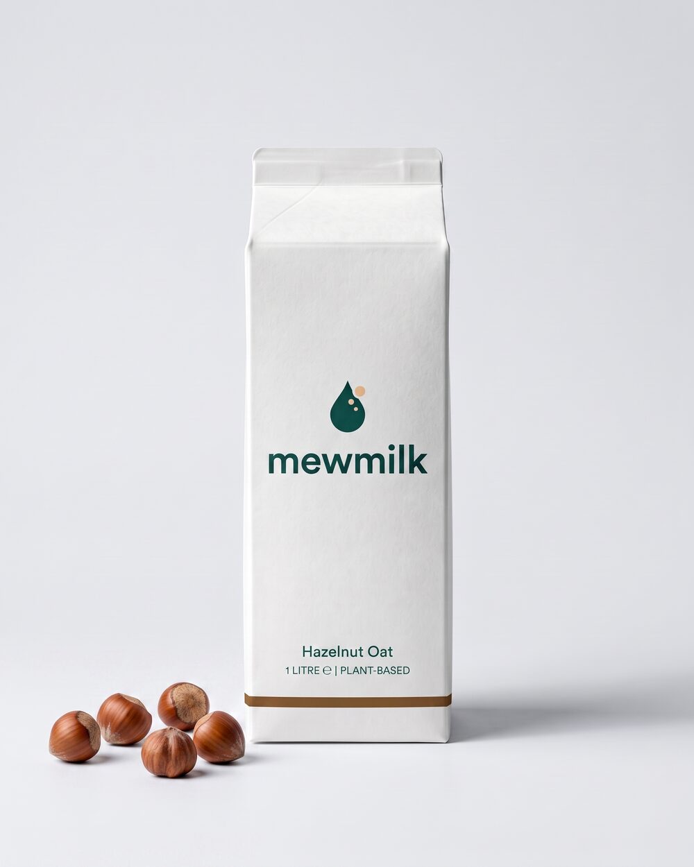 1L Hazelnut Oat carton with a handful of hazelnuts alongside